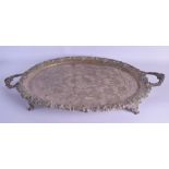 A LARGE LATE 19TH CENTURY SILVER PLATED TWIN HANDLED TEA TRAY decorated with acorns and vines. 68 cm
