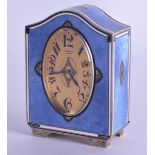 A FINE ART DECO SILVER AND ENAMEL DESK CLOCK by E Gubelin, of elegant scrolling form, highlighted