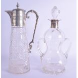 AN UNUSUAL ANTIQUE TWIN HANDLED SILVER DECANTER AND STOPPER together with a silver plated claret