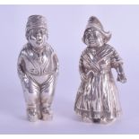 A PAIR OF ANTIQUE CONTINENTAL SILVER CONDIMENTS in the form of a standing male and female. 5.8 oz.