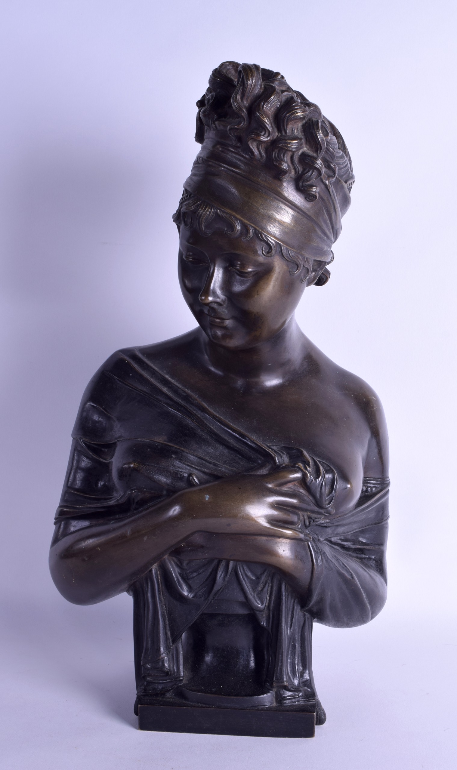 A LOVELY ART NOUVEAU BRONZE BUST OF A FEMALE modelled holding robes across her chest. 45 cm high.