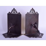 A STYLISH PAIR OF AUSTRIAN SECESSIONIST MOVEMENT MIXED METAL BOOK ENDS by Schweiger, modelled as