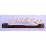 A 19TH CENTURY JAPANESE MEIJI PERIOD CARVED IVORY OKIMONO modelled as eight roaming elephants upon a