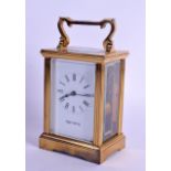 A MAPPIN & WEBB BRASS CARRIAGE CLOCK with black numerals. 15 cm high inc handle.