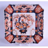 A LARGE 19TH CENTURY JAPANESE MEIJI PERIOD IMARI SQUARE FORM PORCELAIN DISH painted with urns and