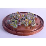 A RARE COLLECTION OF SOLITAIRE MARBLES of large size, of various designs. Largest 2.75 cm wide. (