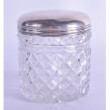 AN ANTIQUE CONTINENTAL SILVER MOUNTED GLASS DRESSING TABLE JAR with facetted body. 9.25 cm high.