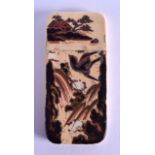 A 19TH CENTURY JAPANESE MEIJI PERIOD LACQUERED IVORY CARD CASE AND COVER decorated with a figure