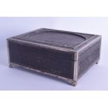 A MID 19TH CENTURY ANGLO INDIAN SILVER MOUNTED CASKET with vacant space for a miniature, carved with