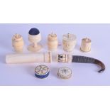 A GROUP OF NINE 19TH CENTURY CARVED IVORY SEWING UTENSILS including string holders etc. (9)