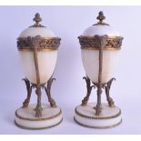 A PAIR OF MID 19TH CENTURY FRENCH ORMOLU MARBLE CASSOLETTES with bronze mounts. 23.5 cm high.