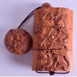 A JAPANESE CARVED BOXWOOD THREE SECTION INRO carved with dragons. 6 cm x 9 cm.