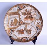 A LARGE 19TH CENTURY JAPANESE MEIJI PERIOD SATSUMA CHARGER painted with figures in various pursuits.