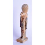 AN EGYPTIAN STYLE FIGURE OF A ROAMING SEKHMET modelled upon a square base. 15 cm high.