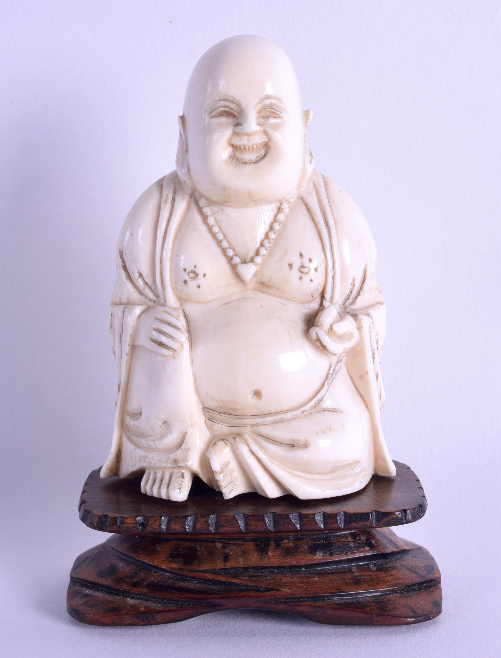 A LATE 19TH CENTURY CHINESE CARVED IVORY FIGURE OF A BUDDHA modelled in robes. Ivory 9 cm x 5.75