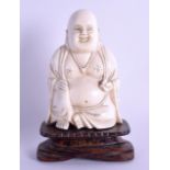 A LATE 19TH CENTURY CHINESE CARVED IVORY FIGURE OF A BUDDHA modelled in robes. Ivory 9 cm x 5.75