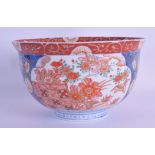 A 19TH CENTURY JAPANESE MEIJI PERIOD IMARI BOWL painted with flowers, birds and landscapes. 18 cm