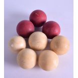 A GROUP OF EIGHT VICTORIAN CARVED IVORY BILLIARD BALLS. 382 grams. 3.5 cm wide. (8)