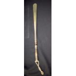 AN UNUSUAL CARVED SHOE HORN, possibly rhinoceros horn. 53 cm long.