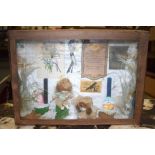 AN EARLY 20TH CENTURY DIORAMA, depicting two dolls surrounded by lace an interior. 24 cm x 34 cm.