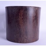 A GOOD CHINESE CARVED HARDWOOD BRUSH POT Bitong, possibly Zitan, of naturalistic form. 1379 grams.