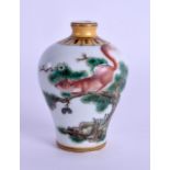 A CHINESE FAMILLE ROSE SNUFF BOTTLE 20th Century, painted with a squirrel amongst foliage. 7.25 cm