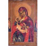 A RUSSIAN POLYCHROMED WOODEN ICON painted with three saints and a child. 13 cm x 20 cm.