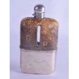 AN EDWARDIAN SILVER AND SNAKE SKIN HIP FLASK. London 1902. 13.5 cm high.