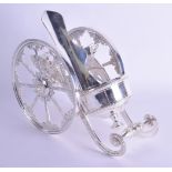 A NOVELTY SILVER PLATED TABLE BOTTLE COASTER formed as a carriage. 29 cm wide.