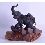 A 19TH CENTURY JAPANESE MEIJI PERIOD BRONZE OKIMONO modelled as an elephant being attacked by two