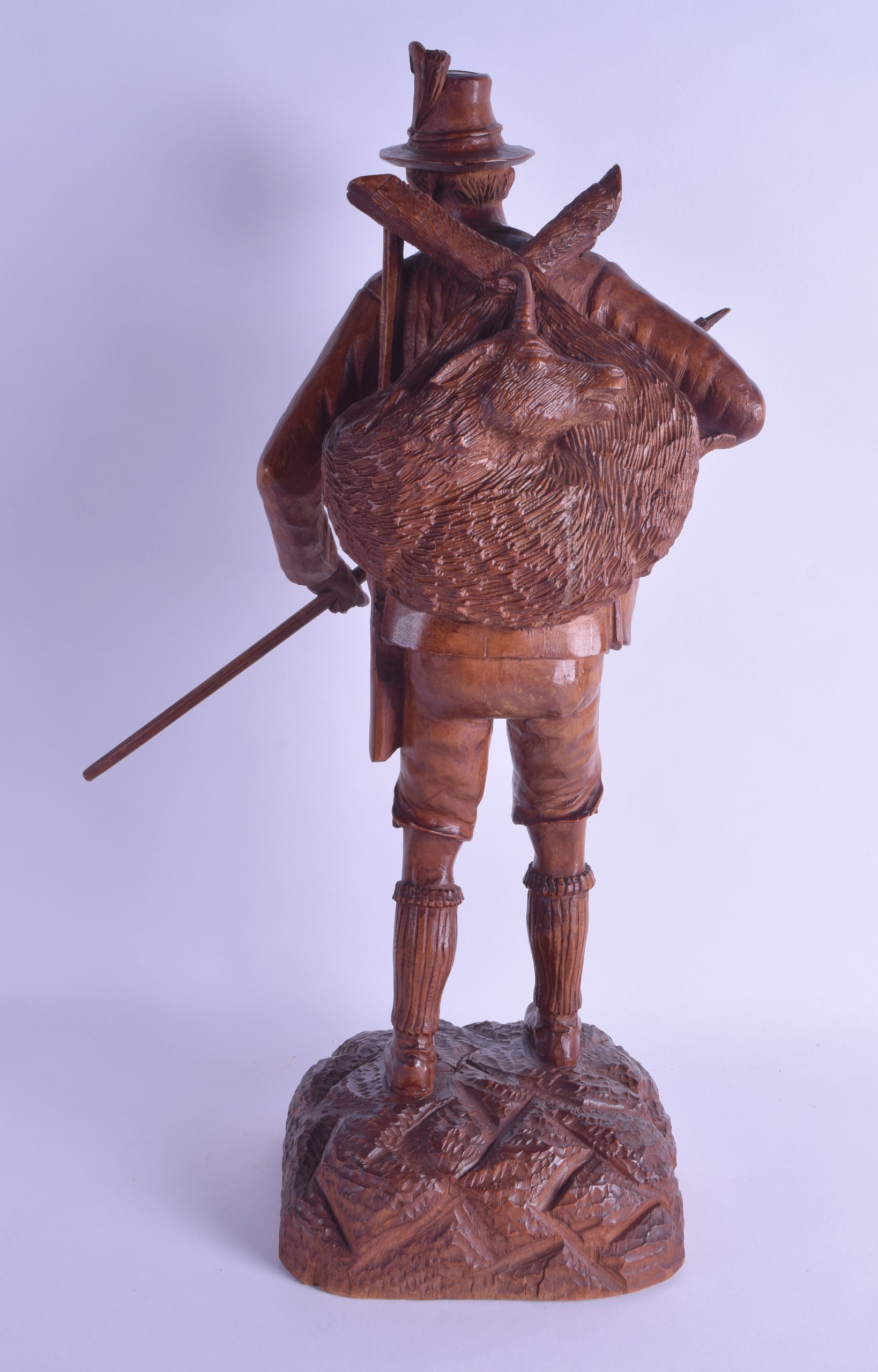 A LARGE EARLY 20TH CENTURY BAVARIAN BLACK FOREST FIGURE OF A HUNTER modelled upon a naturalistic - Image 2 of 3