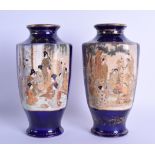 A PAIR OF EARLY 20TH CENTURY JAPANESE MEIJI PERIOD SATSUMA VASES painted with figures within