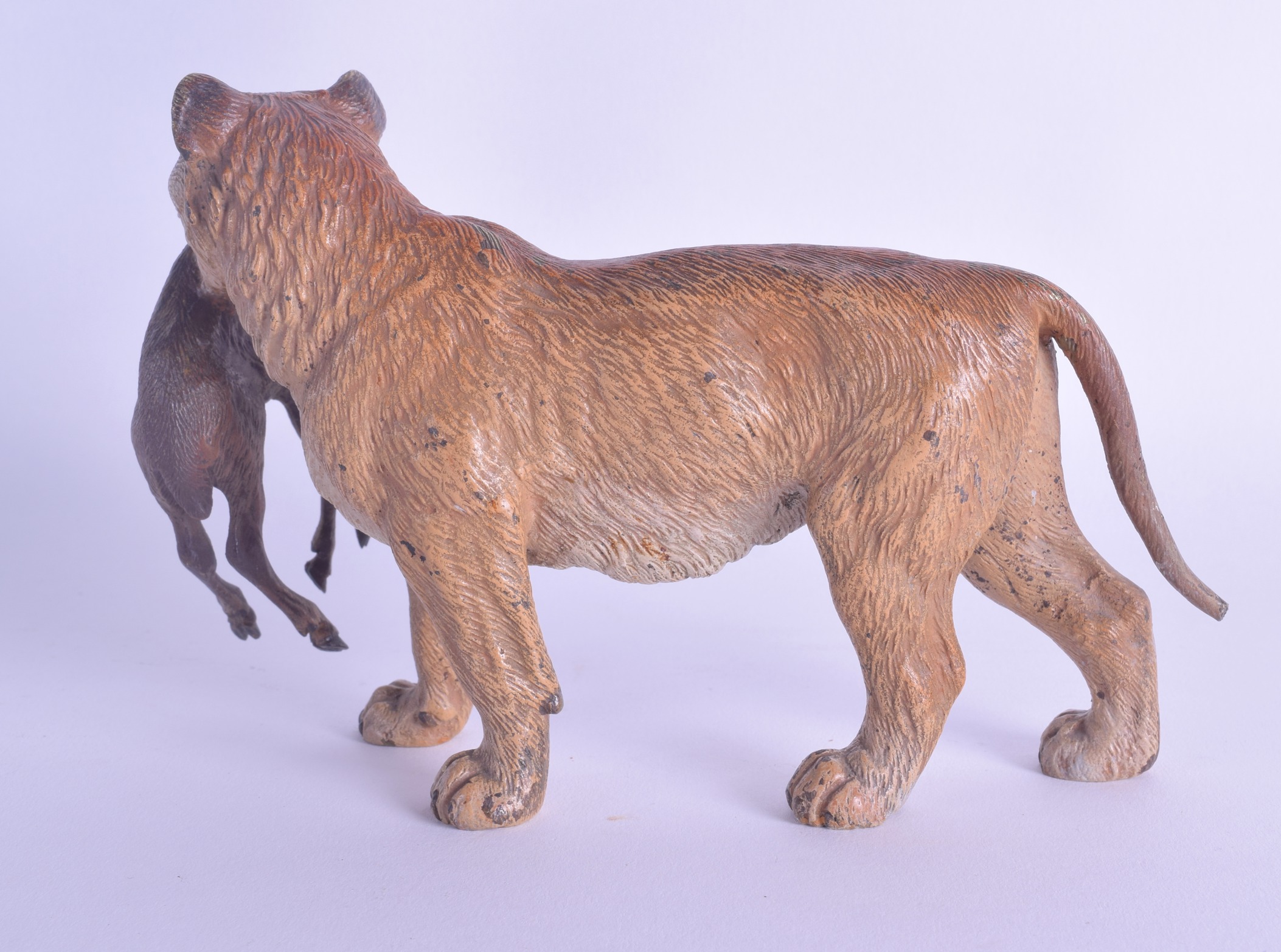 A RARE LATE 19TH CENTURY AUSTRIAN COLD PAINTED BRONZE FIGURE OF A LIONESS modelled holding a kid - Image 2 of 3