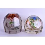 TWO UPRIGHT FLOWER EUROPEAN GLASS PAPERWEIGHTS of faceted form. 9 cm & 8 cm wide. (2)