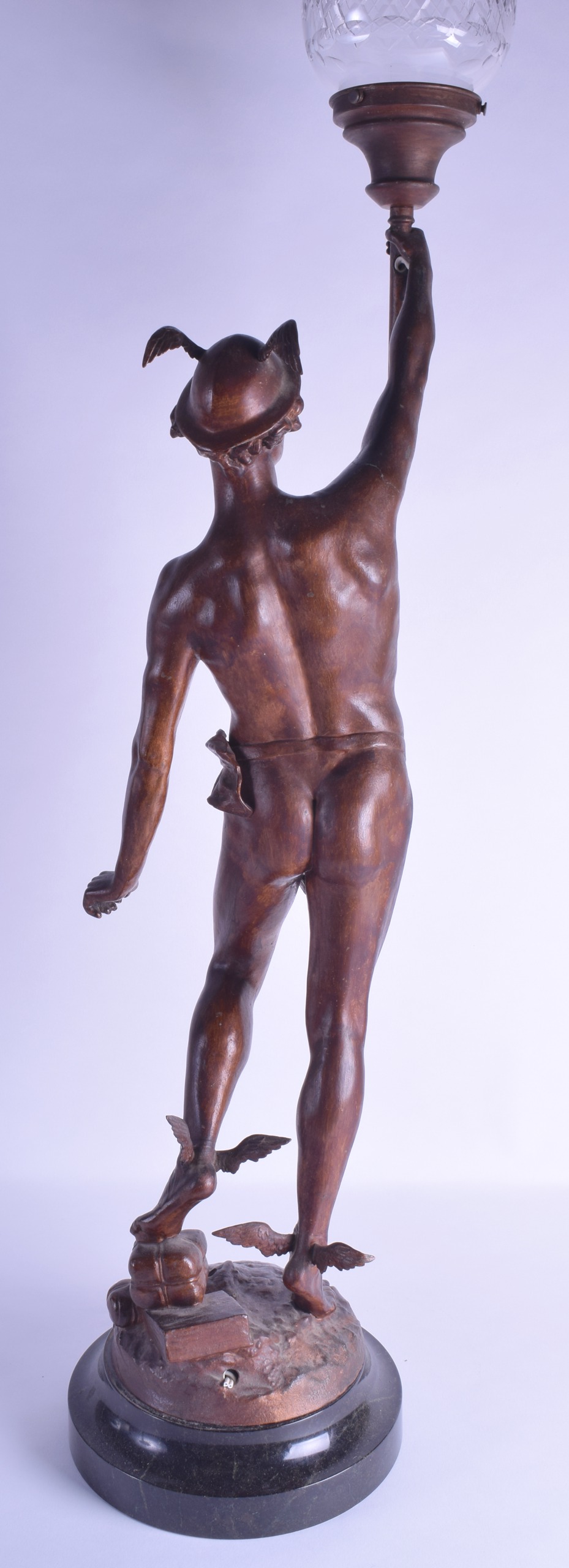 AN ART NOUVEAU COLD PAINTED SPELTER FIGURAL LAMP modelled as a classical male holding aloft a - Image 3 of 3
