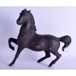 AN ANTIQUE EUROPEAN BRONZE FIGURE OF A ROAMING HORSE modelled with one leg raised. 32 cm x 28 cm.