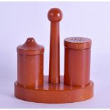 AN ART DECO BAKELITE CATALIN AMBER CRUET SET. 85 grams. 8 cm x 9.25 cm.