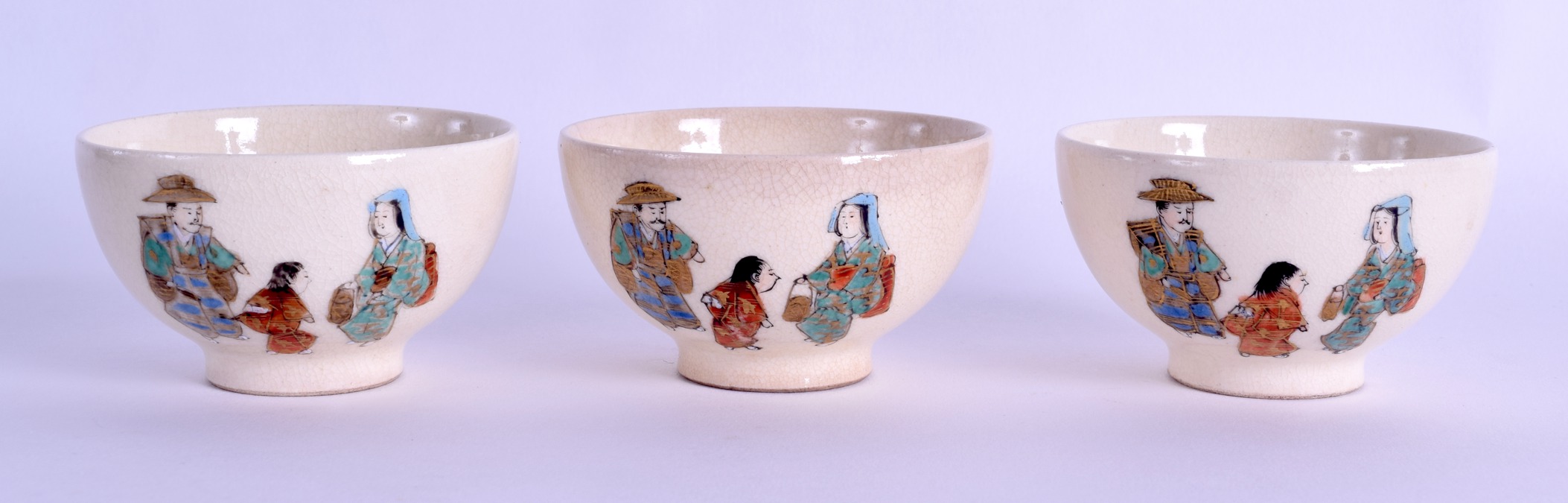 A SET OF THREE EARLY 20TH CENTURY JAPANESE MEIJI PERIOD SATSUMA TEABOWLS painted with figures. 7