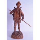 A LARGE EARLY 20TH CENTURY BAVARIAN BLACK FOREST FIGURE OF A HUNTER modelled upon a naturalistic