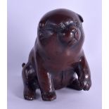 A LATE 19TH CENTURY JAPANESE MEIJI PERIOD BRONZE OKIMONO modelled as a seated dog. 13 cm high.