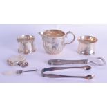 A SILVER CREAM JUG together with silver napkin rings etc. Silver 5.5 oz. (7)