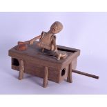 AN EARLY 20TH CENTURY JAPANESE KOBE TOY in the form of a drummer with two serpents and dolphins.