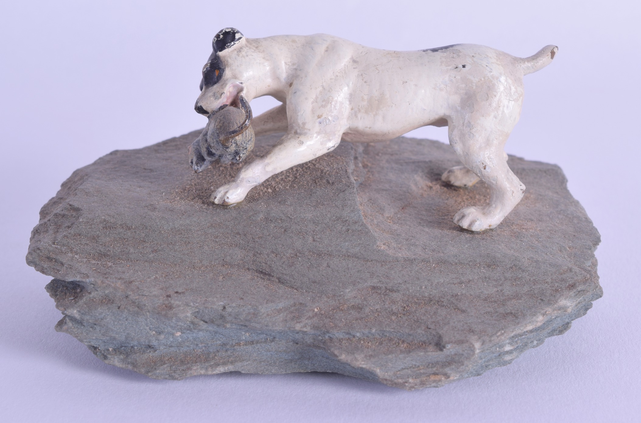 AN EARLY 20TH CENTURY AUSTRIAN COLD PAINTED BRONZE PAPERWEIGHT in the form of a standing hound
