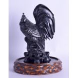 AN EARLY 20TH CENTURY CHINESE CARVED BLACK HARDSTONE FIGURE OF A COCKEREL upon an associated