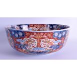 A LARGE 19TH CENTURY JAPANESE MEIJI PERIOD IMARI BOWL painted with a urn of foliage and vines. 31 cm