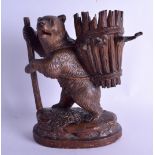 A 19TH CENTURY BAVARIAN BLACK FOREST FIGURE OF A BEAR modelled with an open basket upon his back. 20