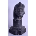 AN EGYPTIAN GRAND TOUR STYLE BUST OF A PHARAOH modelled upon a marble plinth. 30.5 cm high.