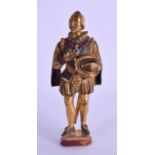 A 19TH CENTURY GERMAN GILT BRONZE FIGURE OF A STANDING MALE modelled upon an agate base. 11 cm
