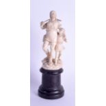 A 19TH CENTURY EUROPEAN CARVED DIEPPE IVORY FIGURE OF A MALE AND CHILD modelled upon an ebonised