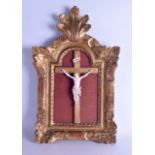 A GOOD 19TH CENTURY EUROPEAN CARVED IVORY CORPUS CHRISTI contained within a period giltwood frame.